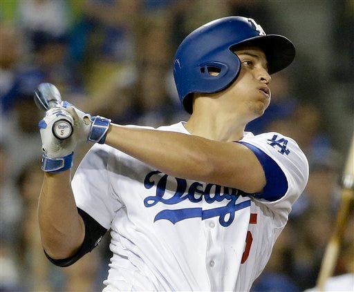 Los Angeles Dodgers' Corey Seager watches his home run against the Atlanta Braves during the sixth inning of a baseball game in Los Angeles, Friday, June 3, 2016. (AP Photo/Chris Carlson)