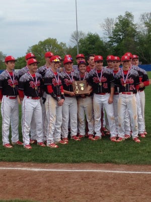 Times-Reporter/Jim Haynes The Hiland Hawks claimed the Division III state baseball championship on Satudray. Here the Hawks pose with their district trophy en route to the state title.