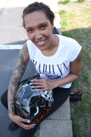 Shannell Williams: 

My daughter’s name is Trinity. It’s from ‘The Matrix.’ I’m from Wareham but I have family here. I work, I take care of my daughter and I ride. She was born June 3. She’s 8. 

My favorite tattoo is my Sugarskull. She’s kind of like me, you know, edgy like my alter-ago. She’s glamorous but she’s got a rough side and that’s how I am – so sweet, but don’t me going. 

This tattoo, ‘Casey Boy’ – was my first tattoo I got when he died. He was 17-years-old. He was a German Shepherd Rotty mix. I loved him. 

I love stars, I have 40 star tattoos. I’m a star in my own little way. Then my mother/daughter trinity knot – that’s a must-have. She’s everywhere. Her name, her face. I’m like a walking canvas. When I had the Sugarskull done I said she didn’t look complete so I said ‘sew her lips shut.’ I sat for seven hours for her. It hurt so bad. I like pain. I like seeing the end result. 

I have no patience if I want something; I want it done right then. I have my brother’s name and hearts on my back. First one I got when I was 18, Feb. 2. My birthday is Groundhog’s Day. I hate that movie. 

I work at Dunkin’ Donuts. You have to have patience. I want to be a police officer. I know I can do it once I put my mind to it. You got to be away from your family for basic training, though, and I need to see my family. I have to see my daughter, and I check in with my mother. I’m 29-years-old and I still check in with my mother. You only got one mother, you know?

Wicked Local Photo/Emily Clark