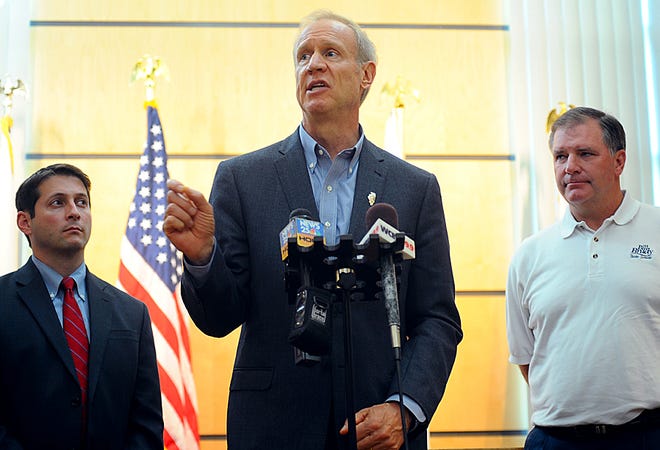 Gov. Bruce Rauner speaks at the Tazewell County Justice Center on Wednesday afternoon about GOP proposals for education funding and a short-term state budget. Rauner is flanked by state Sens. Jason Barickman, left, and Bill Brady, both R-Bloomington.