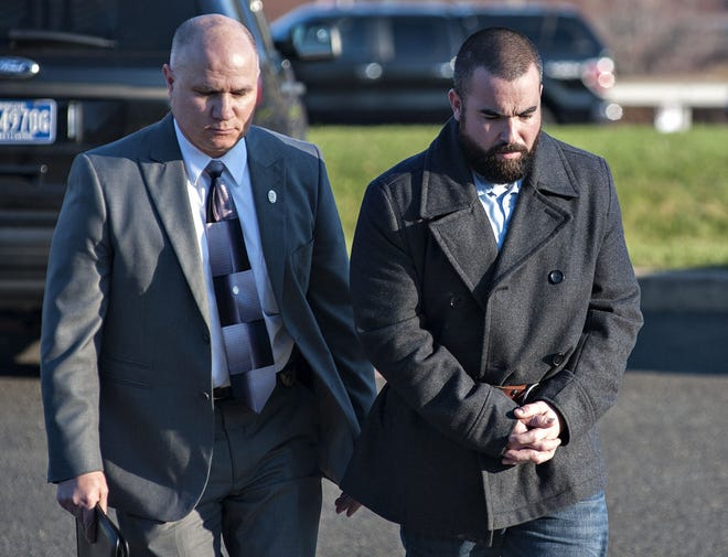 (File) Joseph Becker, a Pennridge teacher, is escorted to his arraignment in December on sexual abuse charges involving a student. Becker pleaded guilty to the crimes during a proceeding at the Bucks County Justice Center in Doylestown on June 6, 2016.