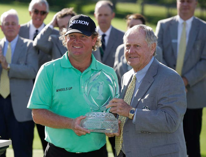 Jack Nicklaus presents the trophy to William McGirt after McGirt won the Memorial golf tournament in a playoff on Sunday.