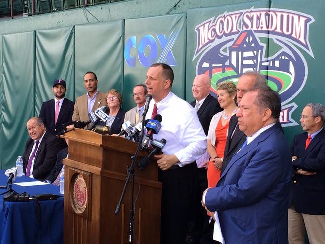 Pawtucket Mayor Donald Grebien addresses the media. Among those looking on are PawSox Chairman Larry Lucchino and PawSox President Charles Steinberg.