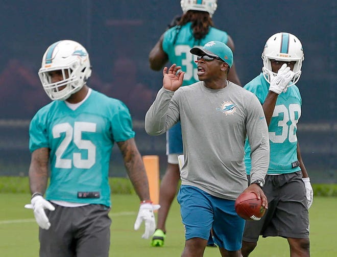 Miami Dolphins defensive coordinator Vance Joseph gives instructions as cornerbacks Xavien Howard, left, and Chimdi Chekwa practice at the team's training facility on Monday in Davie. (AP Photo/Alan Diaz)