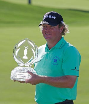 William McGirt holds the trophy after winning the Memorial in a playoff on Sunday in Dublin, Ohio.