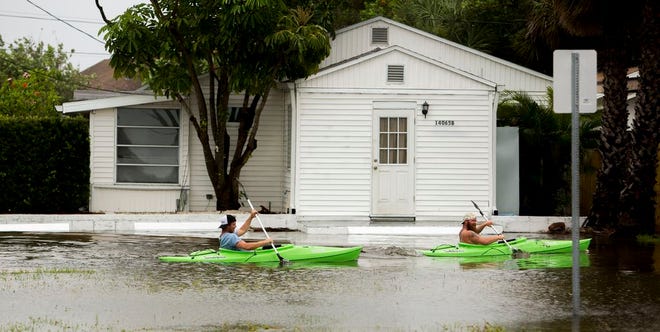 Kayakers paddle south down Palm Street in Madeira Beach, Fla., in flooding from Tropical Storm Colin, Monday, June 6, 2016. (Cherie Diez/The Tampa Bay Times via AP) TAMPA OUT; CITRUS COUNTY OUT; PORT CHARLOTTE OUT; BROOKSVILLE HERNANDO TODAY OUT; MANDATORY CREDIT (Honor "soft outs" for USA Today if entered)