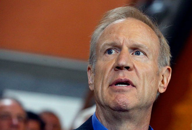 In this May 31, 2016, file photo, Illinois Gov. Bruce Rauner speaks to reporters outside his office at the state Capitol in Springfield. (AP Photo/Seth Perlman File)