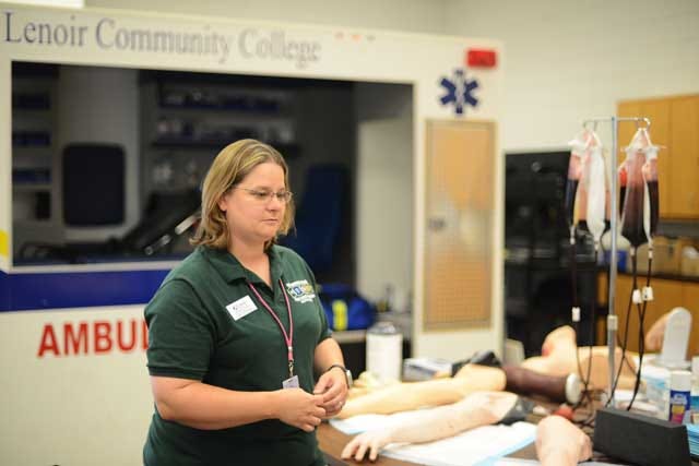 Christine Turner, Lenoir Community College EMS program chairwoman and an instructor, walks through the I.V. learning station on Monday at the school. The EMS program at LCC was recently named the third best online program in the country.