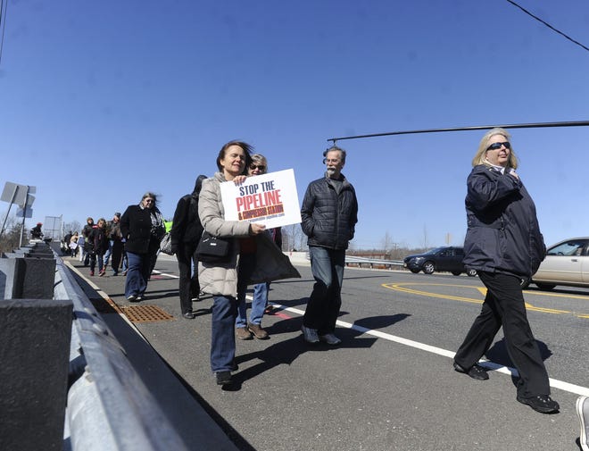 Opponents of a proposed New Jersey Natural Gas pipeline march through northern Burlington County and a related project to construct a natural gas compressor station in Chesterfield march to the site of the proposed Transco Compressor Station on Saturday, Feb. 27, 2016, in Chesterfield.