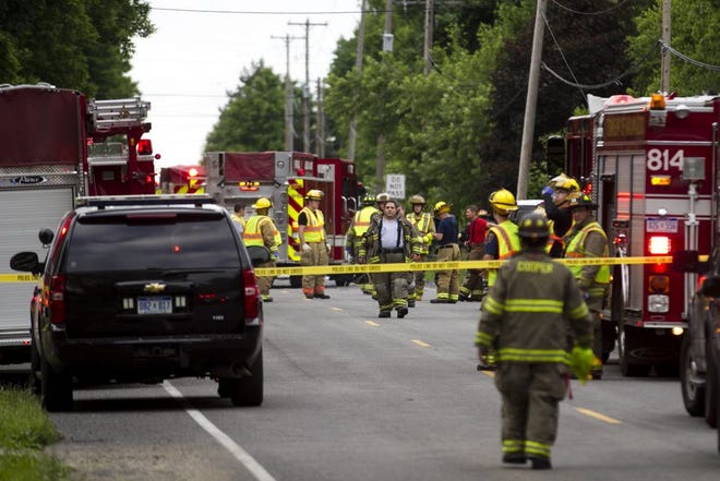 CORRECTS FROM COPPER TO COOPER- Police and rescue workers attend to the scene after multiple bicyclists were struck by a vehicle in a deadly crash Tuesday, June 7, 2016, in Cooper Township, Mich. (Chelsea Purgahn/Kalamazoo Gazette-MLive Media Group via AP) LOCAL TELEVISION OUT; LOCAL RADIO OUT; MANDATORY CREDIT