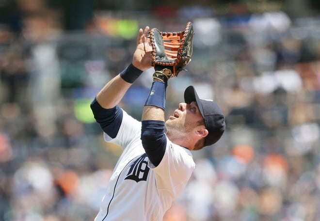 Detroit Tigers first baseman Andrew Romine catches a popup during the third inning of a baseball game against the Toronto Blue Jays, Wednesday, June 8, 2016, in Detroit. (AP Photo/Carlos Osorio)