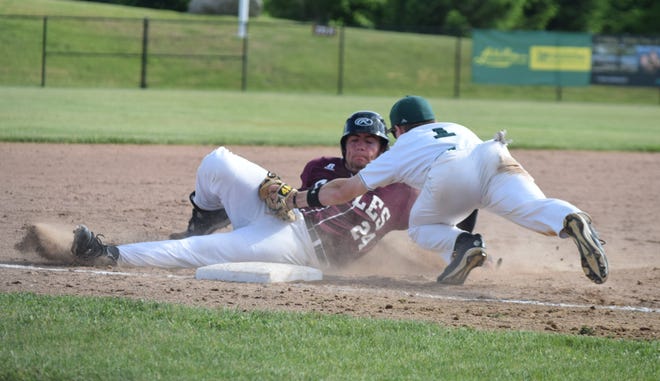 Portsmouth Christian Academy baserunner Wes Tobin, left, is tagged out by Sunapee third baseman Mike Platt in the fourth inning of Wednesday's Division IV semifinals at Robbie Mills Field in Laconia. MIke Zhe/Seacoastonline