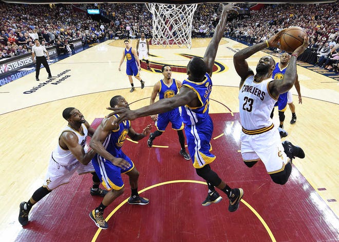 Bob Donnan USA Today Sports via AP Cleveland forward LeBron James drives to the basket against Golden State in Game 3 on Wednesday night. James had 32 points as the Cavaliers won by 30 points after losing Game 2 by 33 points. The Warriors have a 2-1 series edge.