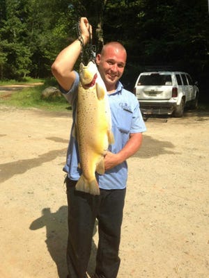 Courtesy of the Georgia DNR Chad Doughty caught the Georgia state record brown trout that weighed 20 pounds, 14 ounces in 2014.