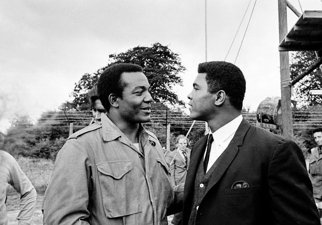 In this Aug. 5, 1966, file photo, Muhammad Ali, right, visits Jim Brown on the film set of "The Dirty Dozen" at Morkyate, Bedfordshire, England. The death of Muhammad Ali last week sent Brown, a four-time NFL MVP, and Kareem Abdul-Jabbar, the NBA's all-time scoring leader, strolling down memory lane. Associated Press/File