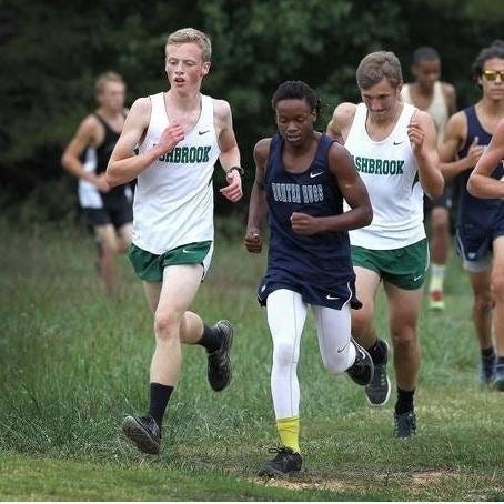 Pictured at left, Ashbrook High senior Mikhail Kogan competes in the Cross Country Gaston County Championship at Forestview High on Sept. 22, 2015. He helped his team capture the county championship at the meet.