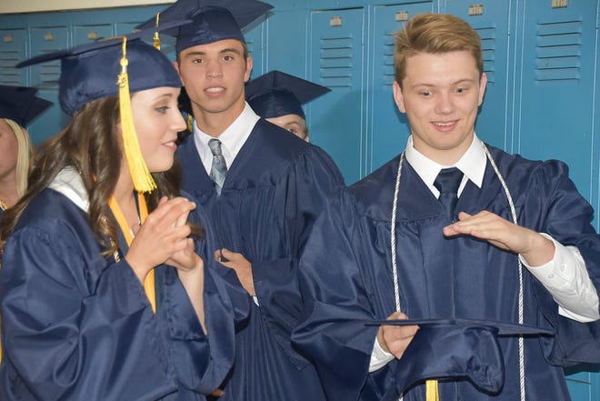 Seniors at Richlands High School celebrate together before walking across the stage at the Richlands High School Class of 2016 graduation at Richlands High School on Thursday.