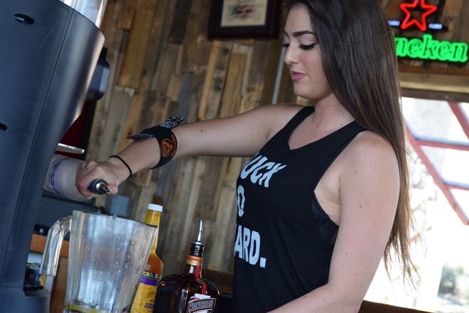 Bartender Heather Lynn serves up a milkshake. “The atmosphere in this place is just really awesome,” she said.