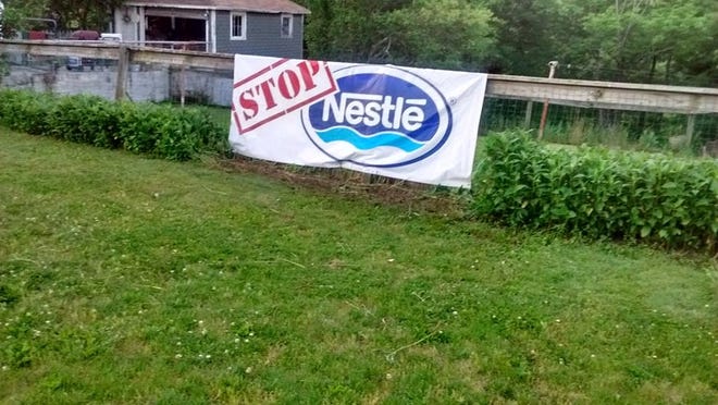 A banner opposing Nestle Waters in the yard of an Eldred Township resident. (Howard Frank/Pocono Record)