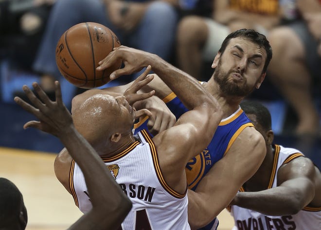 Cleveland's Richard Jefferson, left, and Golden State's Andrew Bogut make contact during the first half of Game 4 of the NBA Finals on Friday in Cleveland. ASSOCIATED PRESS/RON SCHWANE