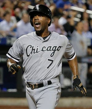 Chicago White Sox's Jimmy Rollins (7) reacts after scoring against the New York Mets on a base hit by Brett Lawrie during the eighth inning of a baseball game, Tuesday, May 31, 2016, in New York. The White Sox won 6-4.