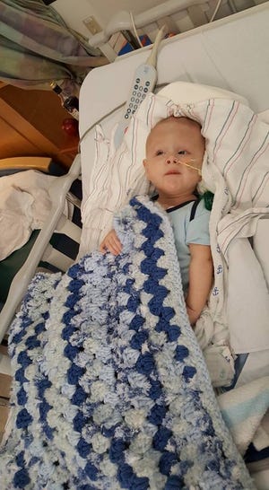 Submitted photo

Bentley Yoder rests at Boston Children's Hospital with a hand-crocheted blanket.