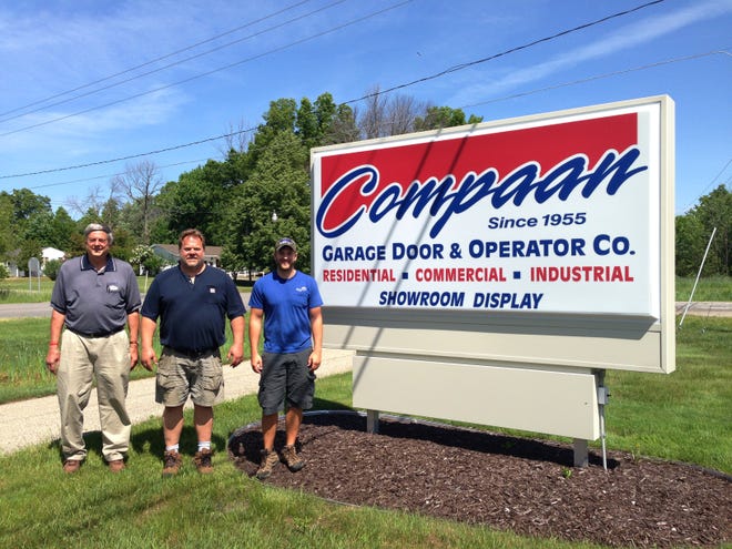 Compaan Door is a 60-year-old, family-owned business in Holland Township. Pictured (L-R): James Jonker, previous owner; Darrin Dreyer, owner; and his son, Travis Dreyer, a shareholder. Justine McGuire/Sentinel staff