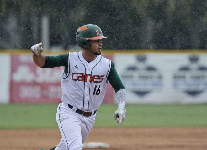 Wilfredo Lee Associated Press Miami's Edgar Michelangeli celebrates as he rounds third base after hitting a grand slam in the seventh inning of Sunday's Super Regional game against Boston College in Coral Gables. The Hurricanes won 9-4 and advanced to the College World Series. Super Regionals roundup, C-5