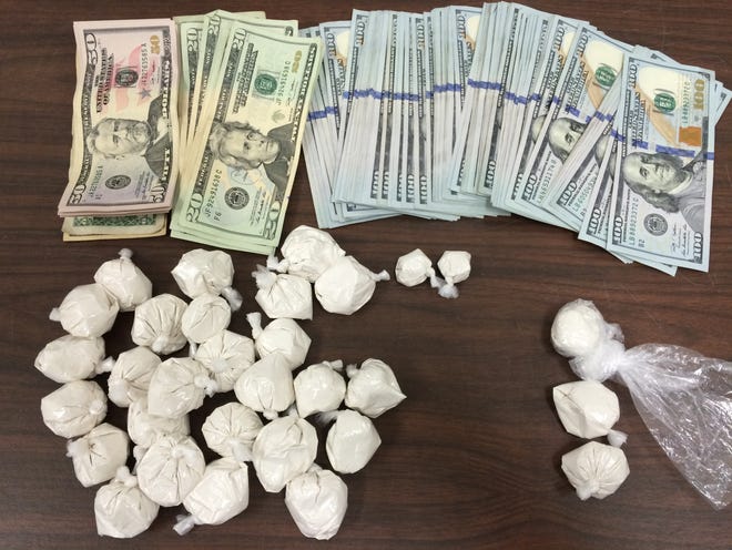 This police photo shows the heroin and cash seized from an accused drug dealer by New Bedford narcotics detectives.

Photo courtesy of the New Bedford Police Department