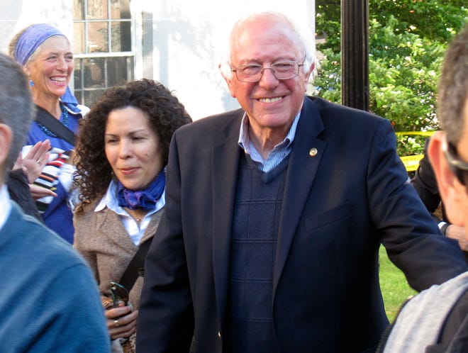 Democratic presidential candidate Sen. Bernie Sanders, I-Vt., arrives at City Hall Park in Burlington, Vt., on Monday, June 13, 2016. Sanders took park during a march and vigil for the people killed and wounded during a shooting at an Orlando, nightclub. (AP Photo/Wilson Ring)