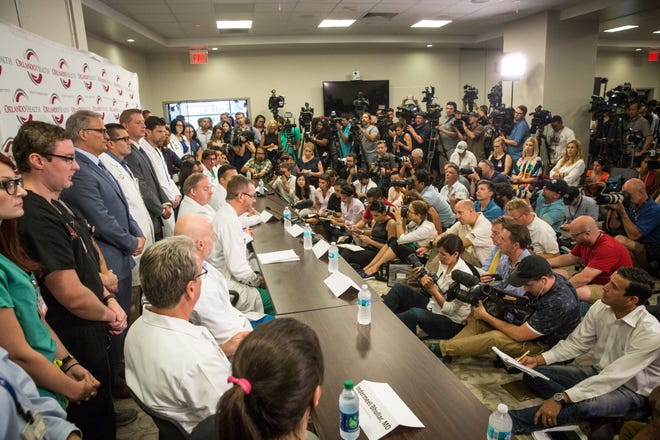 Nine trauma surgeons and survivor Angel Colon speak to the media for the first time about the aftermath of the mass shooting that killed dozens and hospitalized many more at an Orlando gay nightclub, during a press conference at the Orlando Regional Medical Center in Orlando, Fla., on Tuesday, June 14, 2016. (Loren Elliott/Tampa Bay Times via AP)
