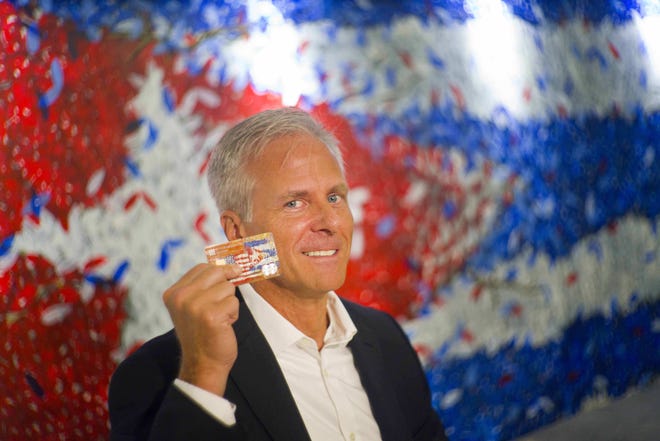 In this June 8, 2016 photo, Stonegate Bank President David Seleski poses with a credit card during an interview in Havana, Cuba. Stonegate, a small Florida bank, will issue the first U.S. credit card designed to work in Cuba on Wednesday, June 15, making it easier for American companies to do business on an island largely cut off from the U.S. financial system. (AP Photo/Ramon Espinosa)