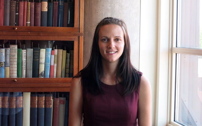 This June 9, 2016 photo shows researcher Natalie Anne Knowlton on the University of Denver law school campus in Denver. Knowlton directed a project at the Institute for the Advancement of the American Legal System, which is housed at DU, that examined the increasing phenomenon of people representing themselves in family court. After speaking to more than 100 people in Colorado, Massachusetts, Oregon and Tennessee who represented themselves in family court, researchers are calling on lawyers to provide cheaper services and courts to offer more support. (AP Photo/Donna Bryson)