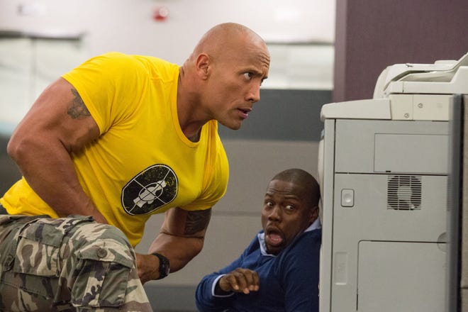 Dwayne Johnson (left) and Kevin Hart take cover in "Central Intelligence."