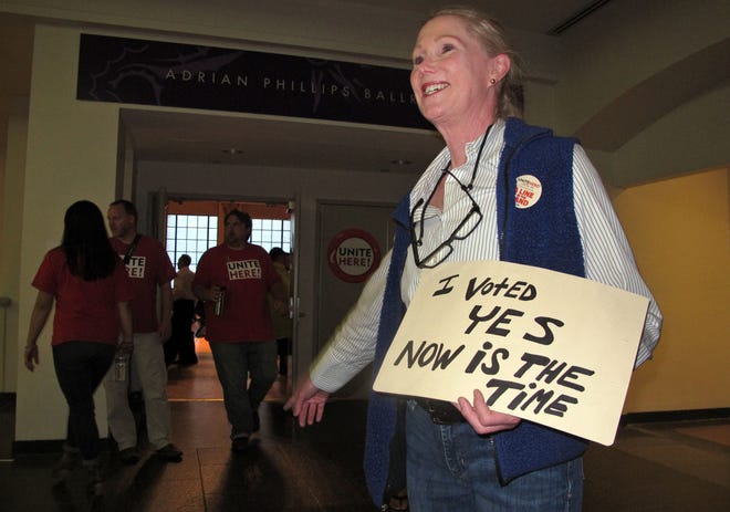Ruthann Joyce directs members of Local 54 of the Unite-HERE union to a voting room, Thursday June 16, 2016, in Atlantic City, N.J., as the union decideds whether to authorize a strike against Bally’s, Caesars, Harrah’s, Tropicana casinos. The union has already authorized a strike against the Trump Taj Mahal. (AP Photo/Wayne Parry)