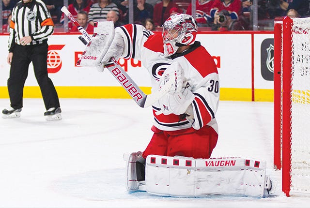 Cam Ward #30 of the Carolina Hurricanes makes a save during the NHL game against the Montreal Canadiens at the Bell Centre on February 7, 2016 in Montreal, Quebec, Canada.