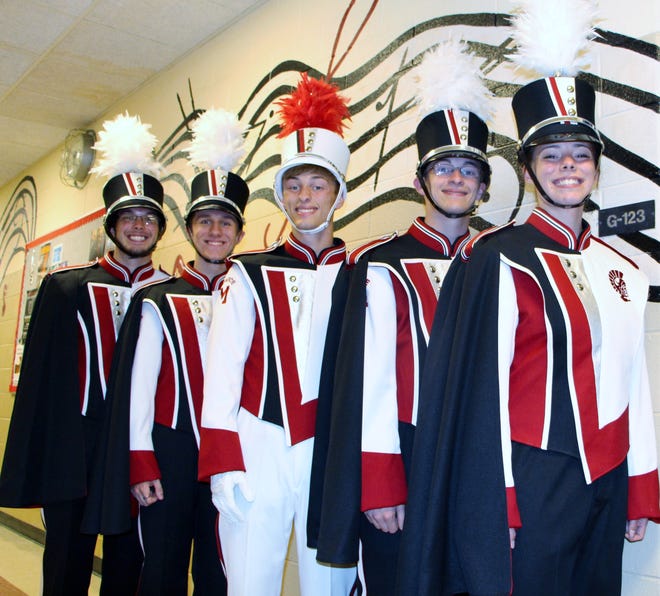 — Photo courtesy of Monroe Public Schools

Monroe High School Marching Band members (from left) Spenscer Saltsman, Curtis Jewell, Grant Prater, Drew Prater and Brianna Finley offer a preview of the group’s new uniforms.