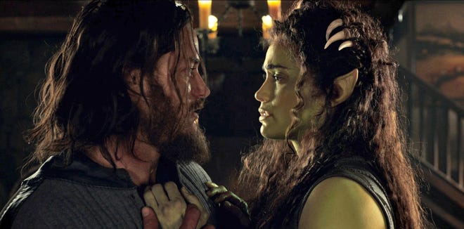 Travis Fimmel as Commander Anduin Lothar left, and Paula Patton as Garona in “Warcraft.” (Universal Pictures)