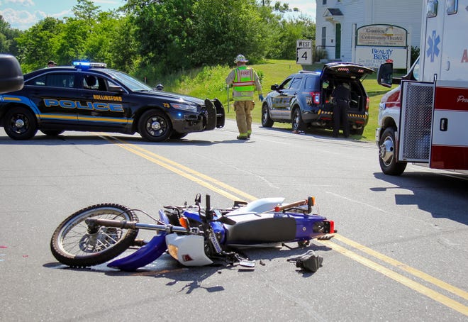 A motorcycle lays on its side in the middle of Portland Avenue after a motor vehicle accident Friday afternoon in Rollinsford. Shawn St. Hilaire/Fosters.com