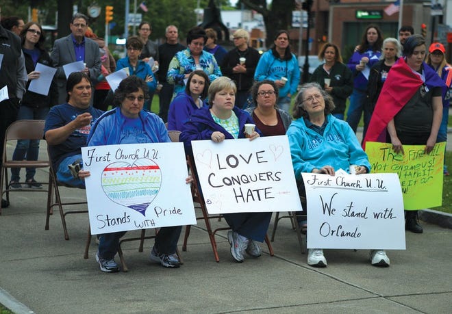 Signs of support were everywhere at Monday night’s vigil for those affected by this weekend’s massacre in Orlando.