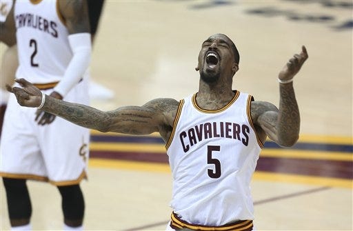 Cavaliers guard J.R. Smith (5) celebrates a basket during the second half of Cleveland's 115-101 victory over the Golden State Warriors in Game 6 of the NBA finals on Thursday. RON SCHWANE/THE ASSOCIATED PRESS