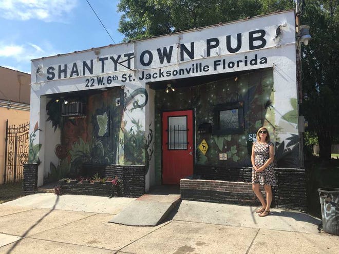 Christina Parrish, head of the Springfield Preservation and Revitalization Council, visits one of the neighborhood hangouts, Shantytown Pub on West Sixth Street.