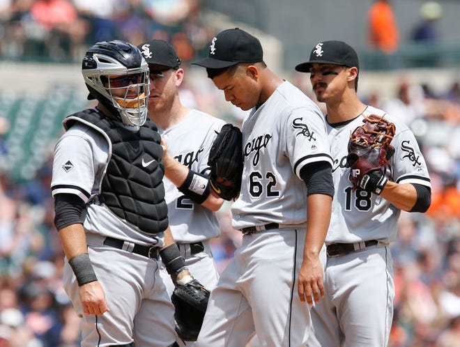 Chicago White Sox's Jose Quintana (62) is visited on the mound by catcher Alex Avila, left, third baseman Todd Frazier and shortstop Tyler Saladino (18) after giving up a double to Detroit Tigers' Cameron Maybin during a baseball game Sunday, June 5, 2016, in Detroit. (AP Photo/Duane Burleson)