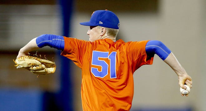 Florida Gators pitcher Brady Singer (51) throws against the UCF Knights at McKethan Stadium on March 2  in Gainesville.