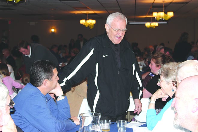 Father Joe shared conversation with the Karinshaks during the anniversary celebration.