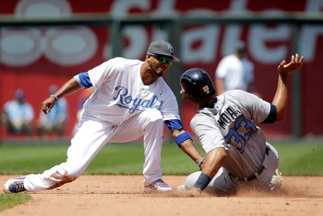 Kansas City Royals shortstop Alcides Escobar tags out Detroit Tigers Steven Moya after attempting to steal second base in the fifth inning of a baseball game at Kauffman Stadium in Kansas City, Mo., Sunday, June 19, 2016. (AP Photo/Colin E. Braley)