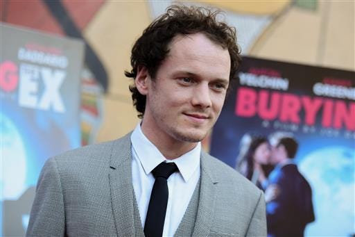 FILE - In this June 11, 2015, file photo, Anton Yelchin arrives at a special screening of "Burying the Ex" held at Grauman's Egyptian Theatre in Los Angeles. Yelchin, a charismatic and rising actor best known for playing Chekov in the new "Star Trek" films, has died at the age of 27. He was killed in a fatal traffic collision early Sunday morning, June 19, 2016, his publicist confirmed. (Photo by Richard Shotwell/Invision/AP, File)