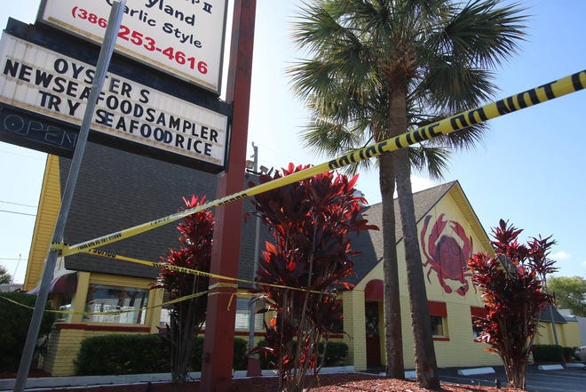 Police tape still surrounds at the Crab Stop on International Speedway Blvd. in Daytona Beach after a shooting Tuesday morning , June 21, 2016.News-Journal/JIM TILLER