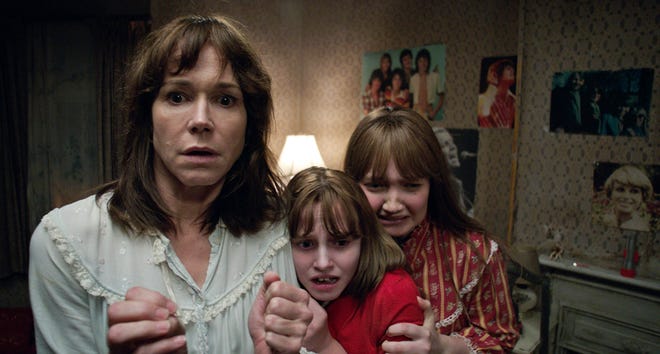 Frances O'Connor (from left), Madison Wolfe and Lauren Esposito in a scene from the New Line Cinema thriller, "The Conjuring 2." (Warner Bros. via AP)