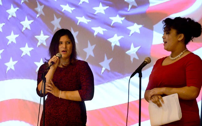 Military students Sierra Secours (left) and Shante English perform the Lee Greenwood song "God Bless the USA" on Tuesday, April 19, 2016, at Northern Burlington's student appreciation breakfast.